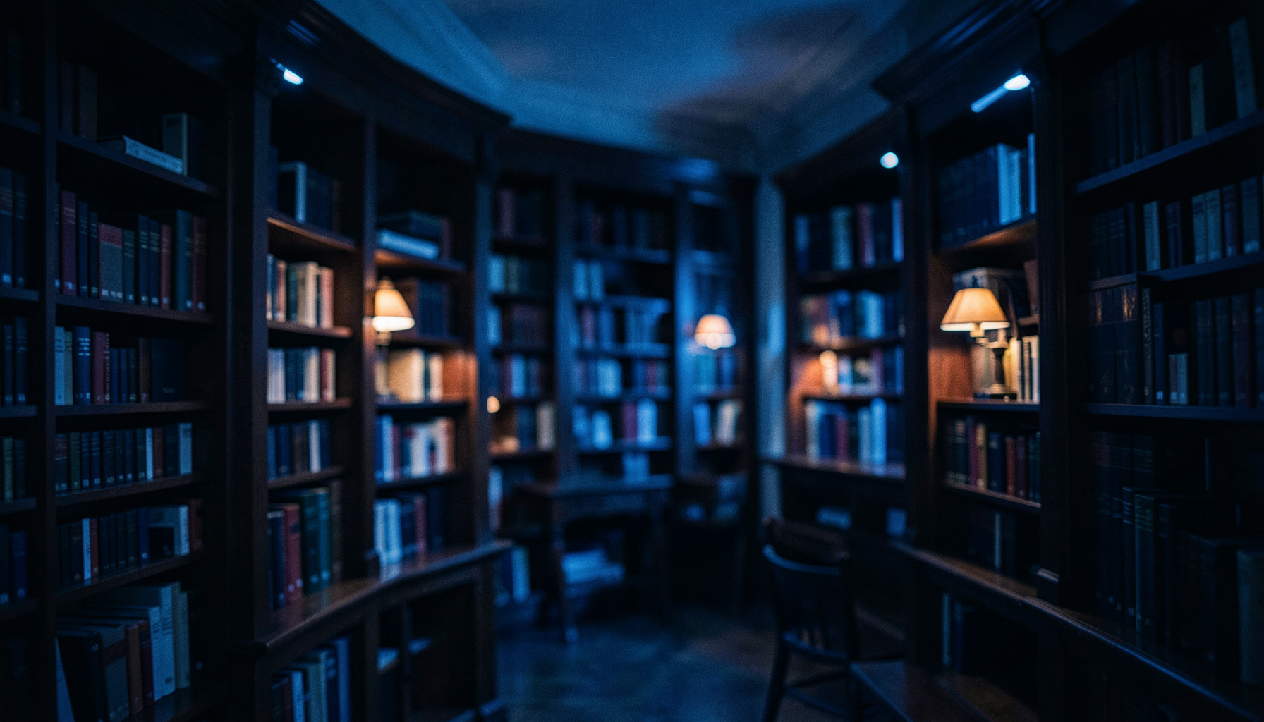 A wide cinematic frame with shallow depth of field showing a softly lit research library interior with dark wood shelves and warm amber reading lamps against deep navy shadows